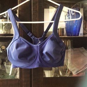 NWT. Sports Bra with adjustable straps and mesh inserts   32DD. Never worn